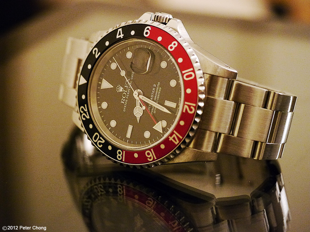 The Rolex GMT-Master II. This one is known as the "Coke", thanks to the color of its bezel.