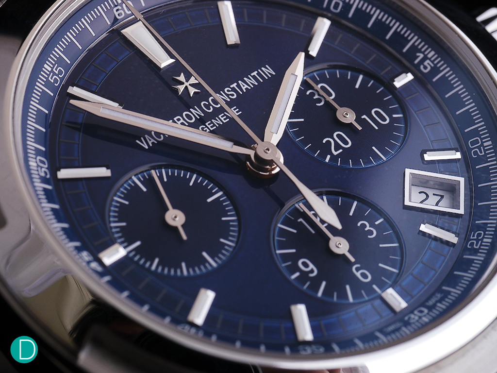 Dial detail showing the play of light on the blue laquer over the dial elements.