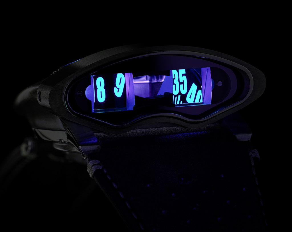 The MB&F HMX Black Badger...time reading side...showing the lume through the prism.