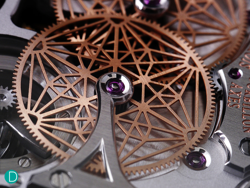 The cock holding one of the driver wheels of the tourbillon system. The matrix design is intricate, and adds beauty to the movement. Execution is exemplary. The bridge itself carries no less than 4 internal angles, each executed very nicely. 