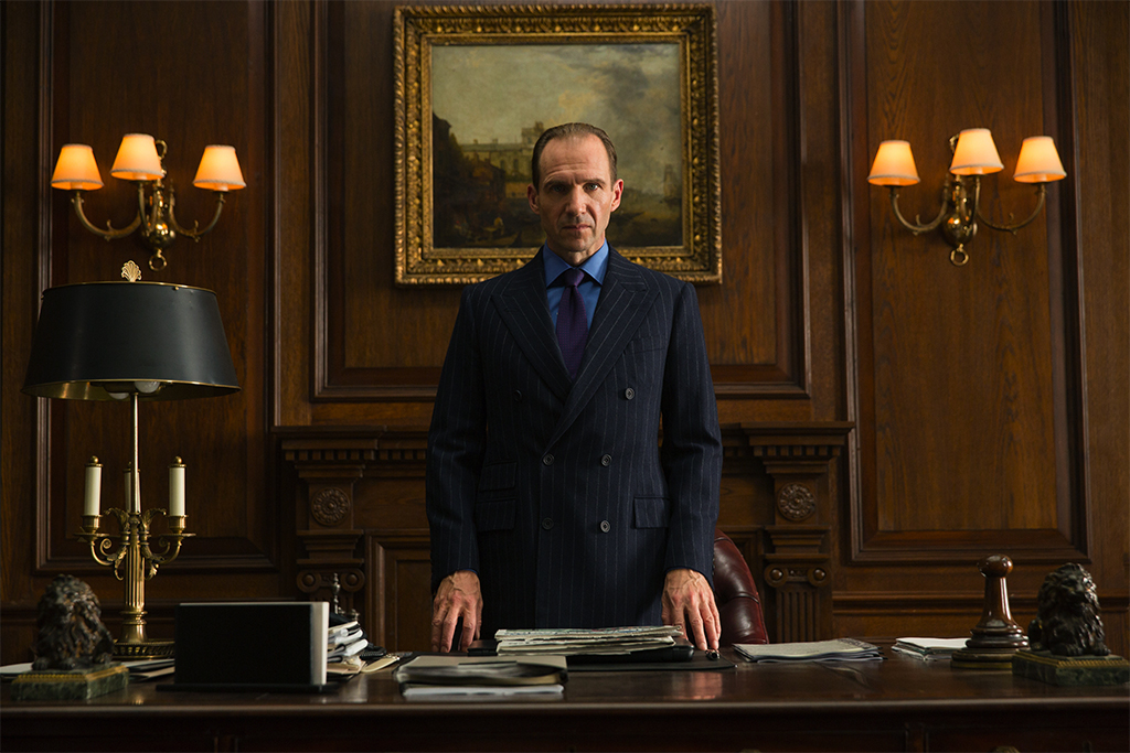 Ralph Fiennes as M in the movie Spectre. Under those immaculate double breasted suit's cuffs is the Longines Heritage Conquest. 