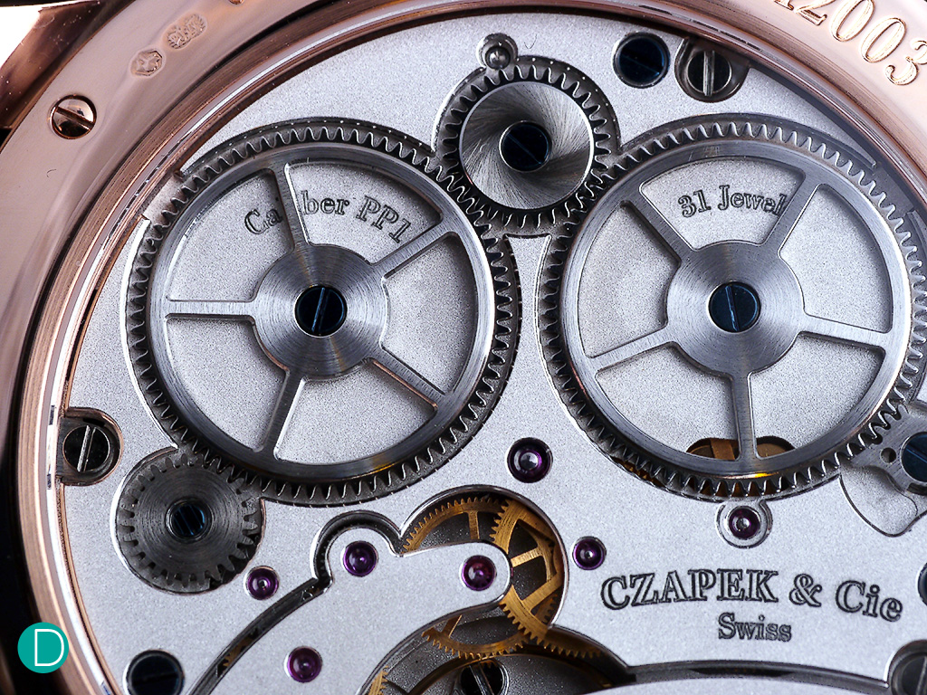 The double barrels of the caliber SXH1 which has a power reserve of 7 days. 