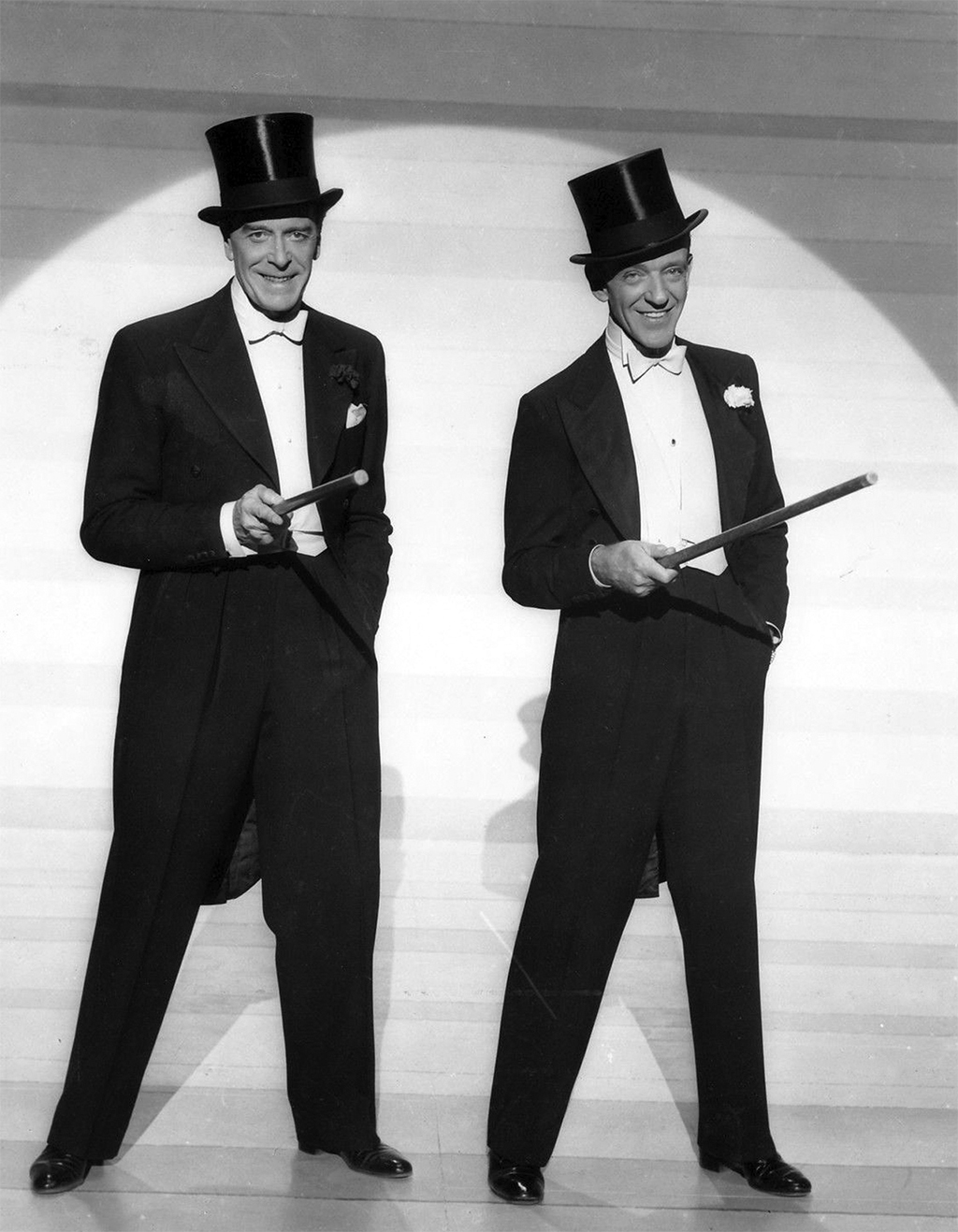 Jack Buchanan and Fred Astaire wearing the classical white tie. This photograph was taken in 1953. 