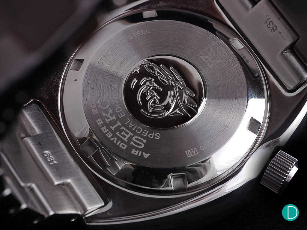 The caseback, showing the PADI markings and the "Project Aware" engraving.